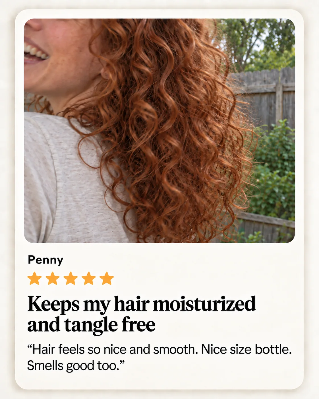 Illustrative close-up of red curls with part of a happy smile at the edge of the photo